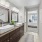 Double vanity with stone counters and framed mirrors