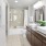 Double vanity with stone counters and garden style tub