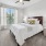 Spacious bedroom with large windows